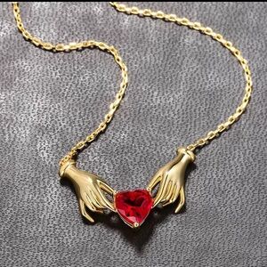 Gold Hands Holding Red Heart Necklace Romantic